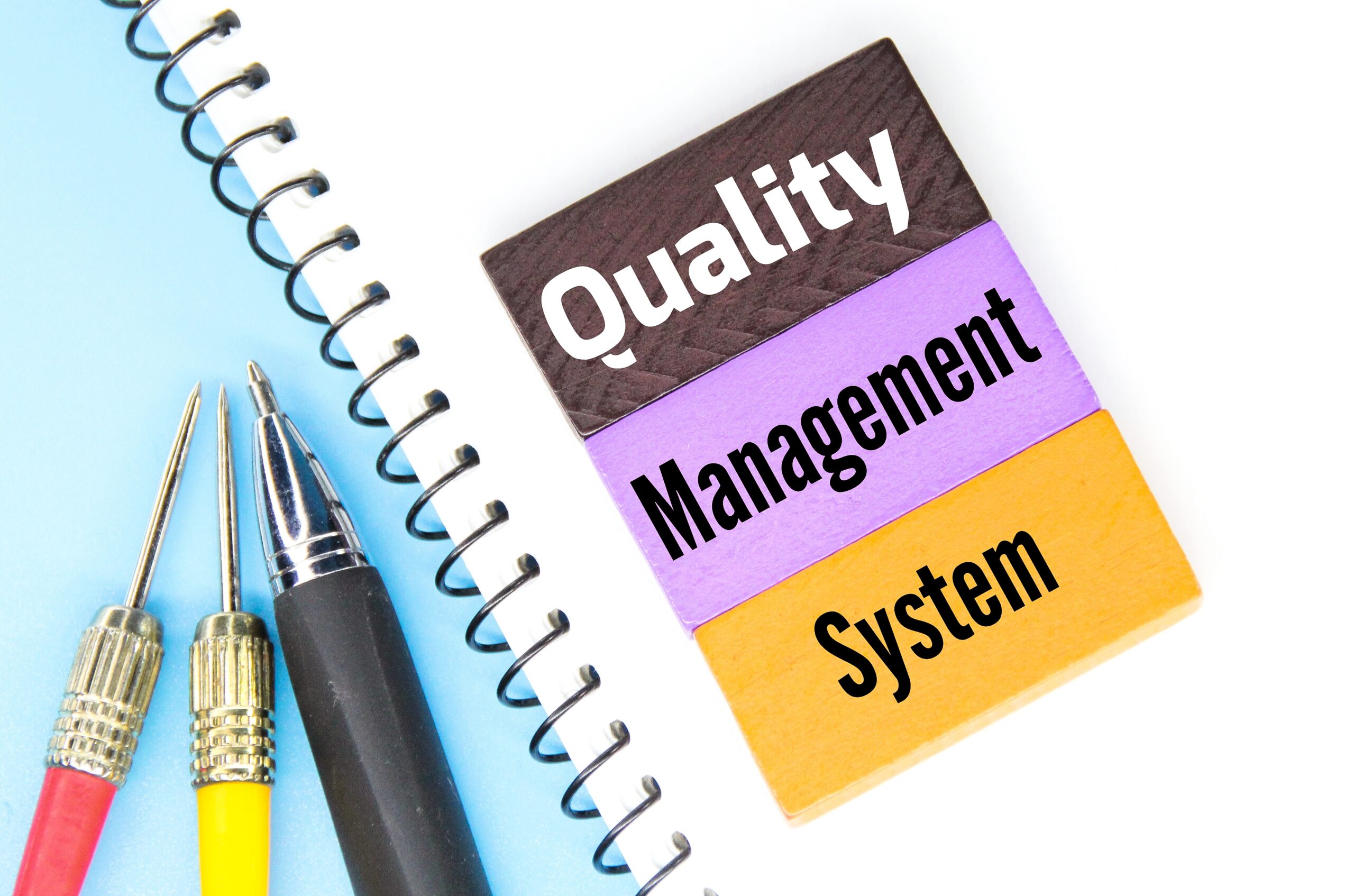 colored-cubes-pens-and-words-quality-management-s-2025-03-09-15-24-36-utc