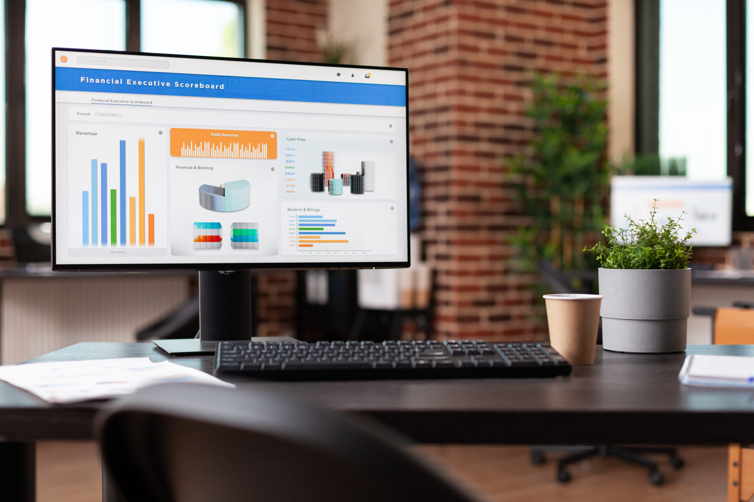 Computer with financial company data on charts in office