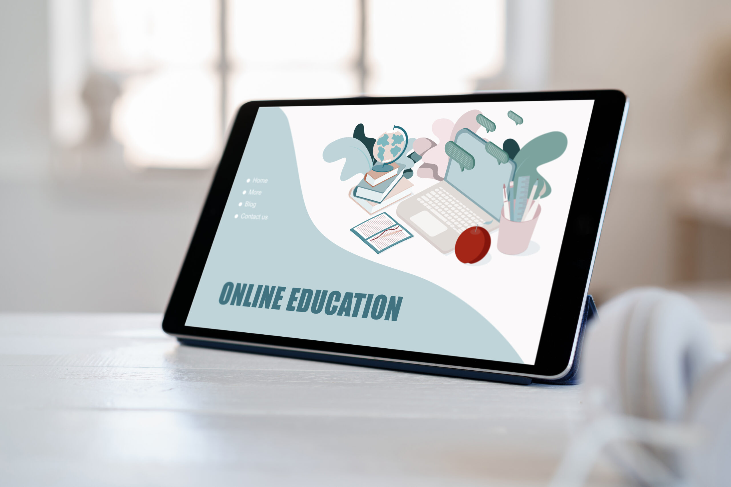 E-learning on digital tablet on white wooden table