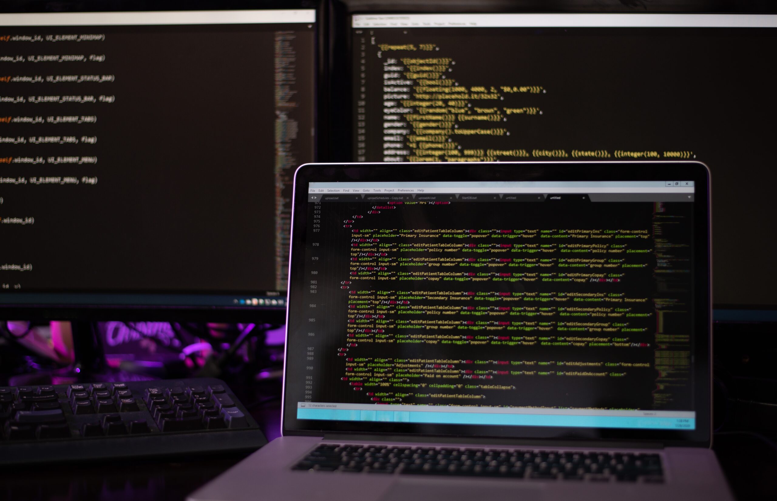 three-computer-screens-with-computer-programming-c-2024-11-01-02-39-11-utc
