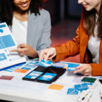 UX developer and ui designer brainstorming about mobile app int