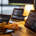 Working on programming dashboard on laptop